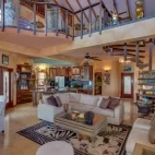 View of a premier villa living room and kitchen at Chabil Mar Villas, Belize.