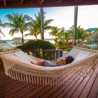 A verandah with a hammock at Chabil Mar Villas, Belize.