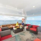 Guest enjoying the views from the upper deck open-air lounge.