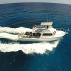 Boat taking divers to sea from Brac Reef Beach Resort in Grand Cayman, the Cayman Islands