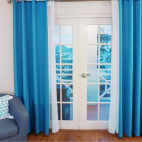 French doors leading to the balcony area in the bedroom at Manta Lodge in Tobago