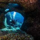 Diver exploring a cave in Malta.