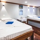 A twin double room on the lower deck of Nautilus Two, in the Central Atolls, Maldives.