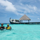 Divers in the water near Adaaran Club Rannahli in the Maldives