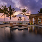 Sunset over the swimming pool at Alila Kothaifaru in the Maldives.