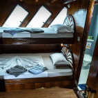 Upper standard double cabin on board Amba liveaboard in the Maldives.