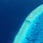 Aerial of a dive boat in the Baa Atoll, the Maldives