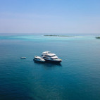 Emperor Voyager liveaboard and dhoni in the Maldives.