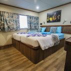 Upper deck twin cabin on board Emperor Voyager liveaboard in the Maldives