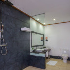 Jacuzzi water villa bathroom at Vilamendhoo Island Resort, Maldives.