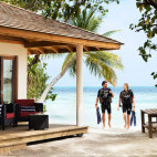 Divers returning to their room at Vilamendhoo Island Resort, Maldives