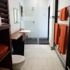 Beachfront fare bathroom at Barrier Beach Resort.