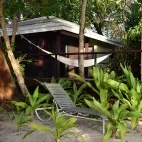 Barrier Beach Resort's beachfront accommodation, complete with hammock.