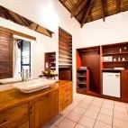 Bathroom in a luxury beachfront fare, at Barrier Beach Resort.