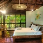 Luxury beachfront fare bedroom at the resort, Espiritu Santo Island, Vanuatu.