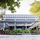 View of the restaurant right by the beach at Barrier Beach Resort, Espiritu Santo Island.