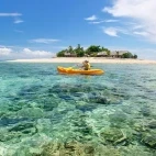 Person kayaking on Mamancua Islands, Fiji
