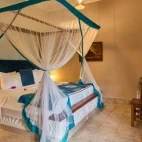 A bedroom interior at Kendwa Rocks Beach Hotel, Zanzibar