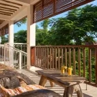 A balcony seating area at Kendwa Rocks Beach Hotel, Zanzibar