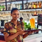 Staff member in the restaurant at Sunshine Azure Beach Hotel, Zanzibar