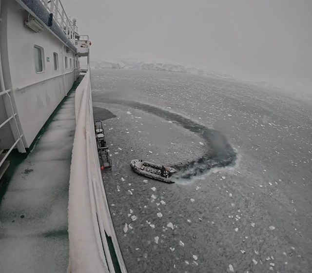 RIB collecting divers to go scuba diving in the Antarctic.