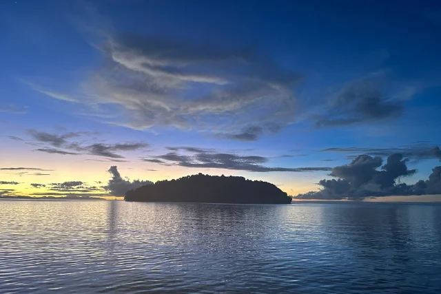 Sunset view of an island in Raja Ampat, Indonesia.