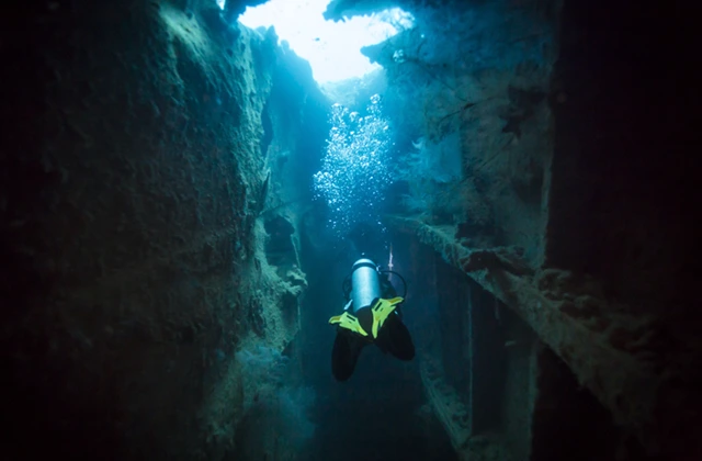Diver exploring a wreck in Coron, the Phillipines