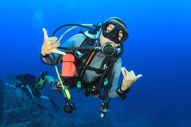 Diver making hand signals in Thailand