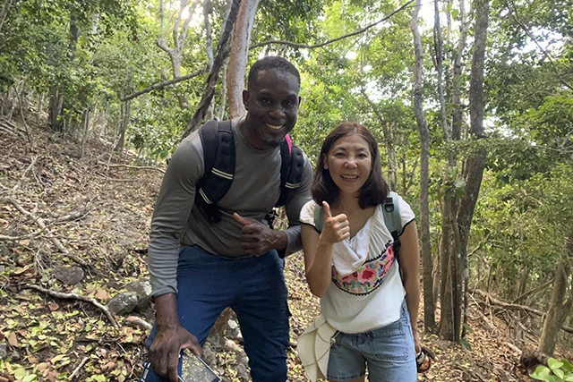 Jobi with her guide, hiking in St Eustatius, Caribbean.